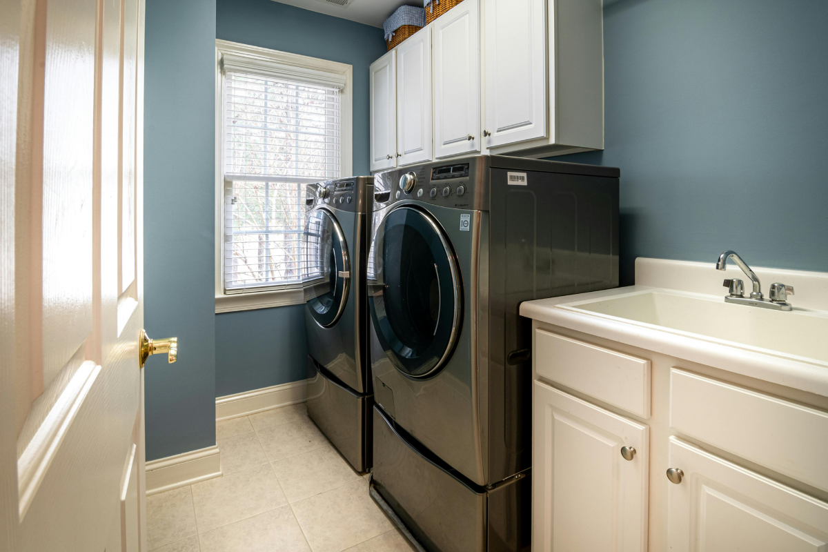 Ventless washer dryer combo installed in a small apartment laundry space
